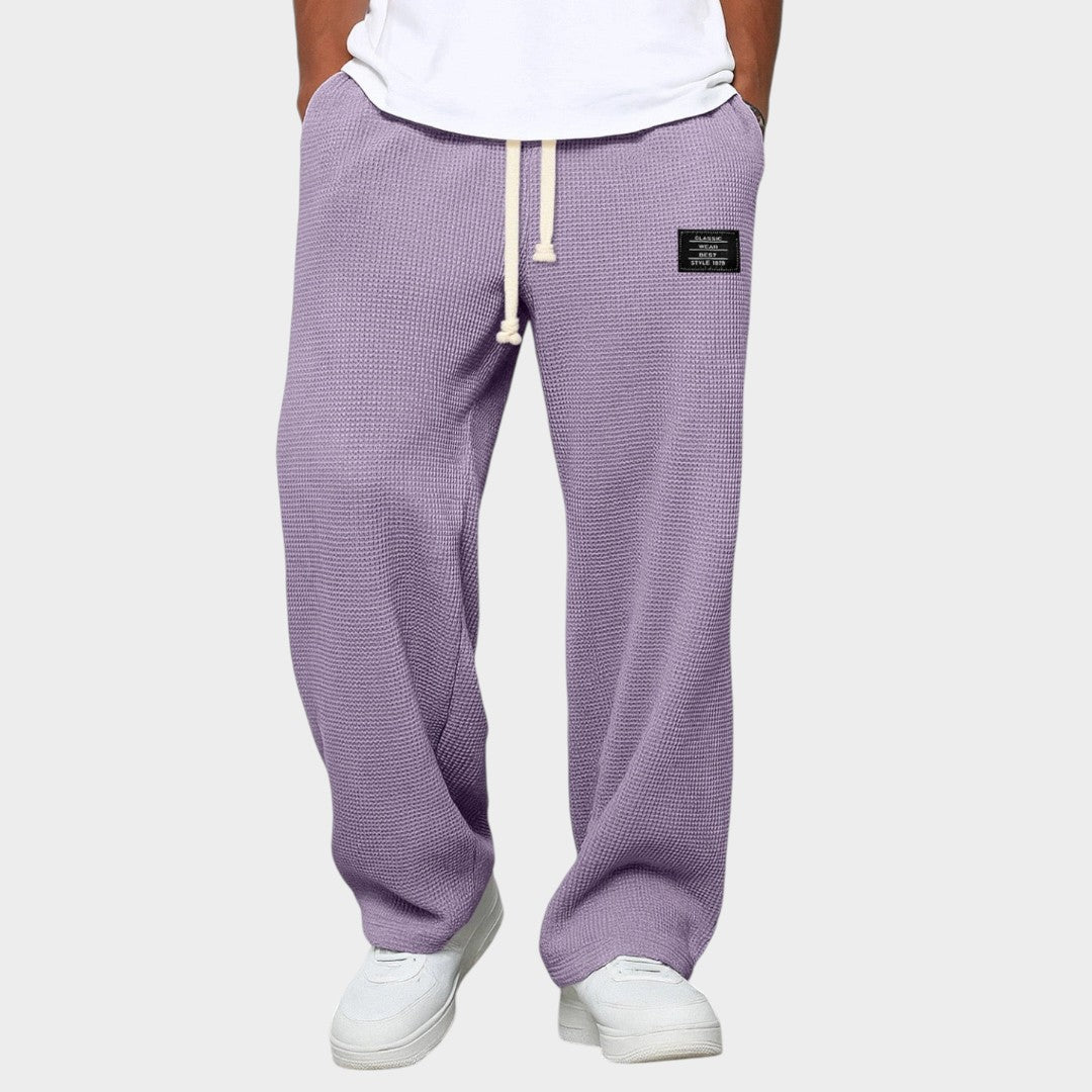 Samuel™ | Široke hlače z nastavljivim pasom" can be rewritten as:

"Samuel™ | Široke hlače z nastavljivim pasom za udobno prileganje" 

If you want something more concise:

"Samuel™ | Udobne široke hlače z nastavljivim pasom